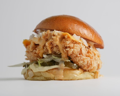 Boom Chicken sandwich - Piece of Chicken + yellow cheese + boom sauce + Japanese mayonnaise, lettuce, pickled cucumber and bun