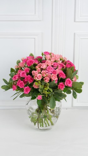 Elegant Vase - The Vase contains baby rose with greens.