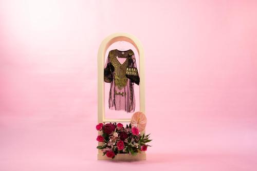 NEW DESIGN 011 - The Wood stand contains flowers and baby dress