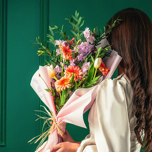 Soho - Hand tied bouquet of pink delphinium, white tulips, peach gerbera with eucalyptus. 
 H 60 cm x W 40 cm.