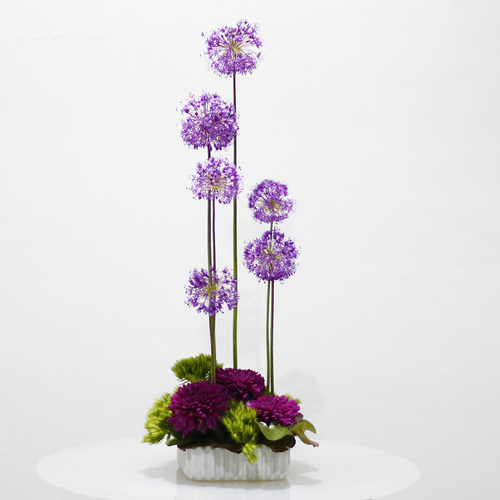 Simply Purple - A square ceramic vase filled with purple allium, mauve chrysanthemum and sweet william with galax leaves. H 75 x W 25 cm.