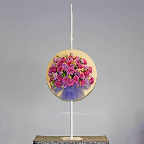 Dos Dizenio Flower Stand 2 - Purple bouquet of roses and lisianthus arranged in round wooden board and hang on a metal stand.