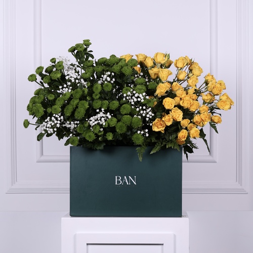 Golden Bloom - A vibrant arrangement of yellow and green flowers with a touch of gypsophila, ideal for someone special.