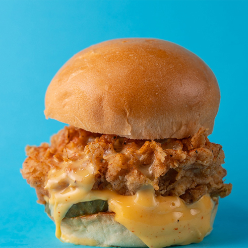 Lets Slider - Cheese and Sauce Slider - Chicken patty with cayenne, cheese sauce, sriracha mayonnaise and sliced pickle.