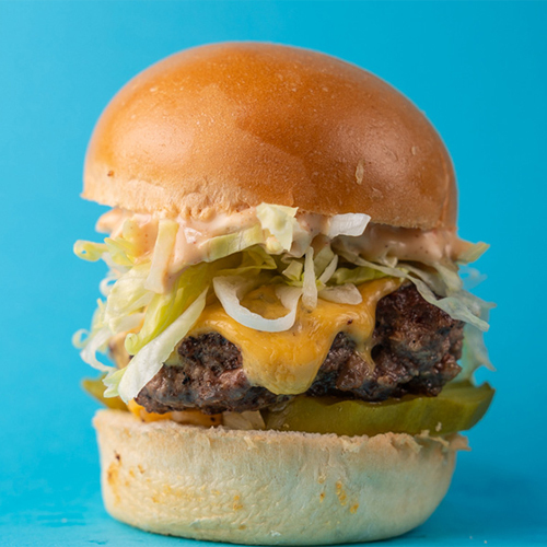 Let's Slider - Beef patty with american cheese, sautéed mustard onions, pickle sliced and shredded lettuce.