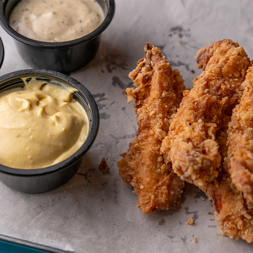 Chicken Tenders - Fried crispy chicken served with two special sauce.