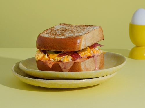EGG WITH BACON - Brioch toast egg bacon with our speical souce