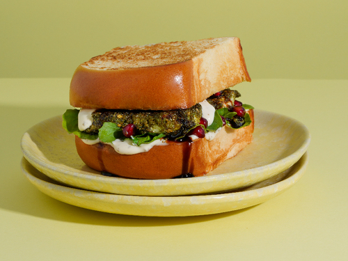 HALLOUMI SANDWICH - Brioche toast, grilled halloumi, rocca, pomegranate and halloumi sauce.
