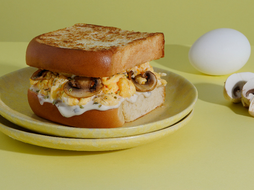 SCRAMBLE EGG WITH MUSHROOM - Brioche toast with mushroom scrambled eggs ranch sauce.