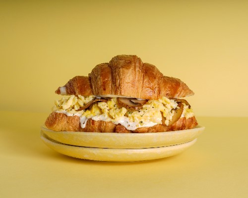 SCRAMBLE EGG WITH MUSHROOM - CROISSANT with mushroom scrambled eggs and ranch sauce.