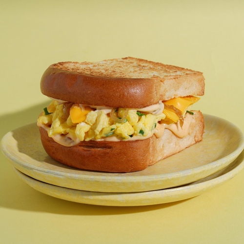 Egglicious - Egg and cheese sandwich with leeks, caramelized onions and special sauce