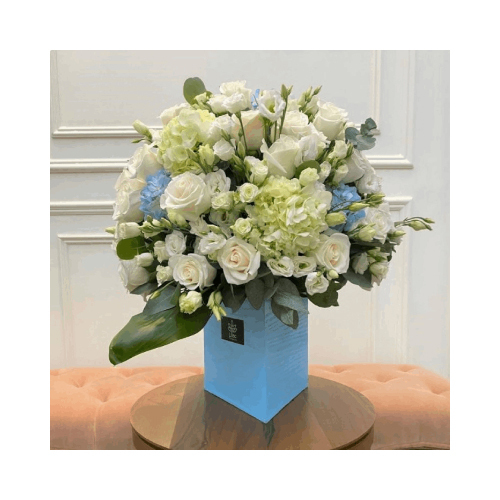 Blue Dream - This blue wooden triangular vase contains roses and hydrangea flowers with green leaves suits baby boy newborn.
Height: 65cm Width: 40cm Sell by: Quantity