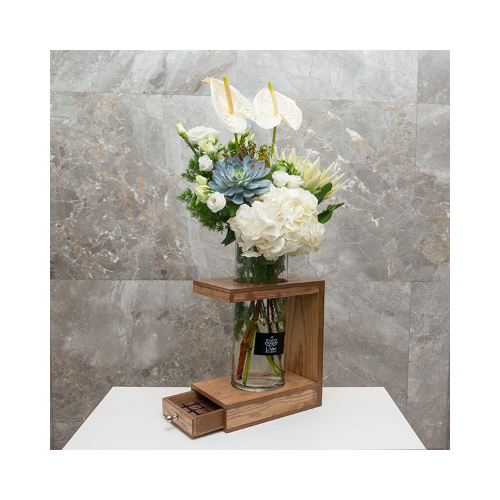 Flash Lights - This wooden basket contains king protea, asthma, hydrangea, anthurium and echeveria with Belgian chocolates.
 Height: 70cm  Width: 38cm  Sell by: Quantity