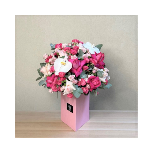 Sweet Dalal - This wooden pink triangle stand contains a mix of a beautiful colored orchid and roses flowers suits newborn baby girl.
 Height: 50cm  Width: 35cm  Sell by: Quantity