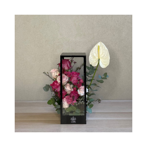 Perhaps - This rectangle acrylic stand open from two sides contains white anthurium and colored roses flowers.
 Height: 40cm  Width: 30cm  Sell by: Quantity