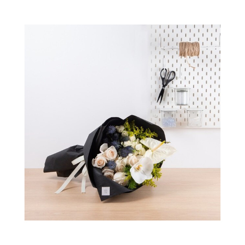 The Light - This hand bouquet contains orchid petal, white roses, anthurium and eryngium. 
Height: 45cm  Width: 30cm  Sell by: Quantity