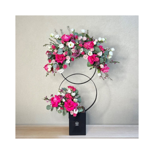 Fluffy Rings 1 - This double rings stand contains a mix of roses and baby roses flowers with Belgian chocolates suites weddings.
 Height: 90cm  Width: 55cm  Sell by: Quantity