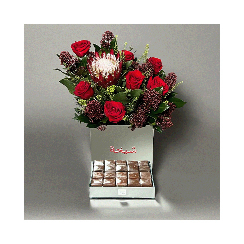 Red Love - A mirror vase contains red roses and protea flowers with Belgian chocolates.
 Height: 45cm  Width: 35cm  Sell by: Quantity