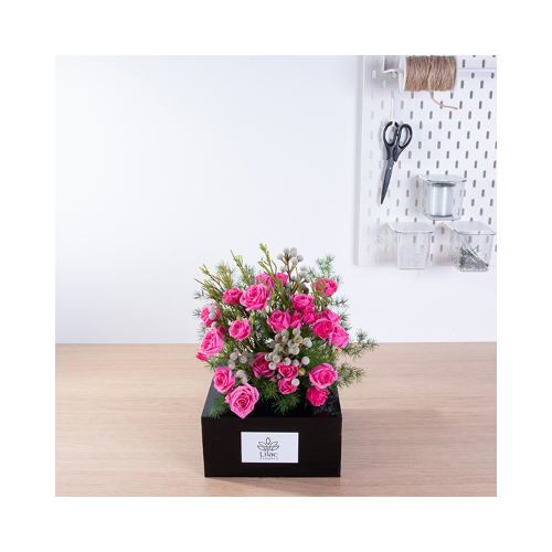 The Garden - A wooden basket with light and dark pink baby roses and protea with Belgian chocolates.
 Height: 55cm  Width: 55cm  Sell by: Quantity