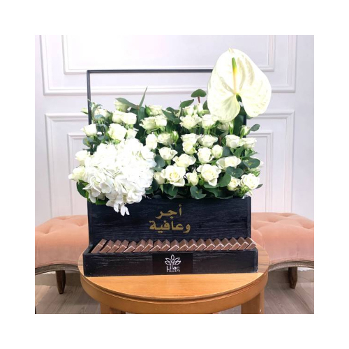 White Night 1 - This black wooden box contains baby roses, hydrangea and white anthurium flowers with Belgian chocolates. 
Height: 43cm  Width: 45cm  Sell by: Quantity