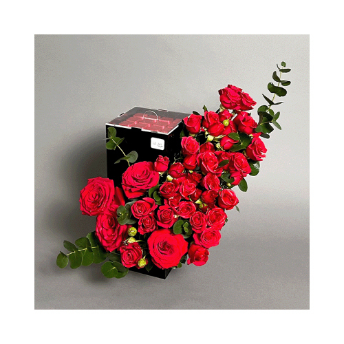 The Flower Of Love - Red roses and baby roses in an acrylic bouquet with Belgian chocolate.
 Height: 40cm  Width: 35cm  Sell by: Quantity