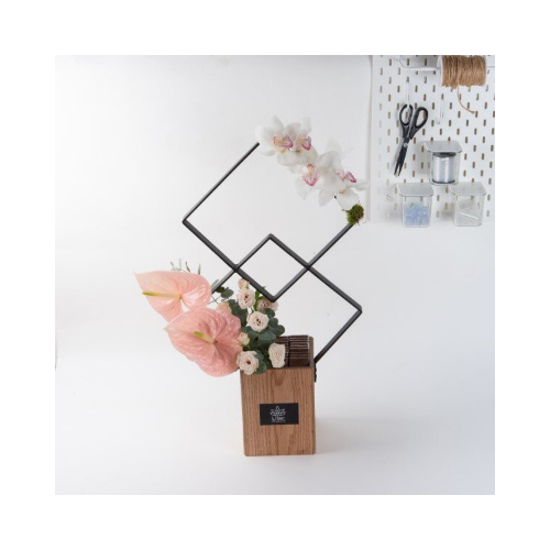 Radiant 2 - This double squared stand contains peach anthurium, baby roses and cat flowers with chocolates.
 Height: 70cm  Width: 40cm  Sell by: Quantity