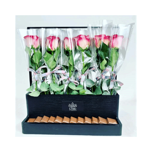 Giveaway Basket - A wooden black basket with 12 single pink wrapped roses and Belgian chocolates for giveaway and Teacher's Day Height: 47cm  Width: 42cm  Sell by: Quantity