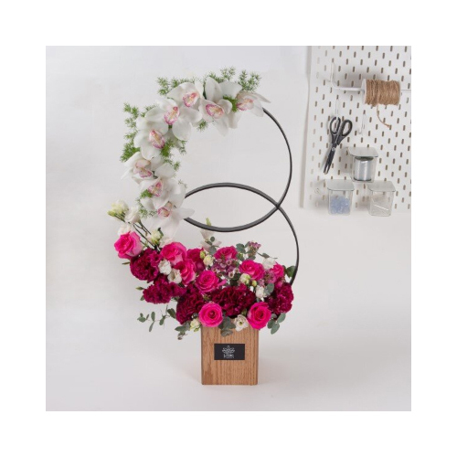 Double Rings - A brown wooden double rings stand contains celosia, cymbidium and eustoma flowers. 
Height: 80cm  Width: 45cm  Sell by: Quantity