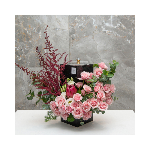 Pink Totality - This rectangle acrylic open from front contains protea, baby rose peach, astilbe, asthma with Belgian chocolates.
 Height: 40cm  Width: 43cm  Sell by: Quantity