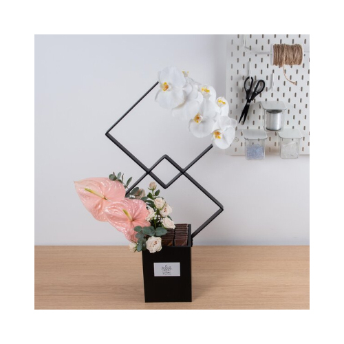 Radiant - This double squared stand black color, contains peach anthurium, baby roses and cat flowers with chocolates.
 Height: 70cm  Width: 40cm  Sell by: Quantity