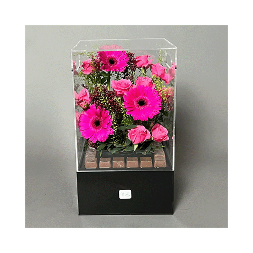 Spring Morning - This acrylic box contains baby roses, gerbera, and limonium flowers with Belgian chocolates. 
Height: 35cm  Width: 25cm  Sell by: Quantity