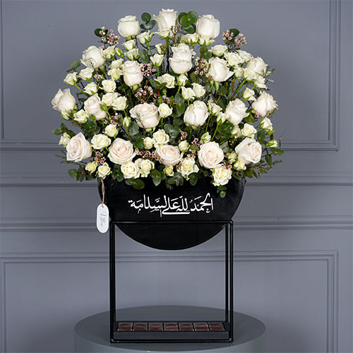 Get well - Black stand contain white rose, white baby rose, white wax and Belgian chocolate. Hight 82 Width 55