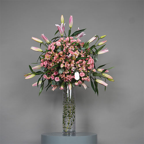 Casablanca - A glass vase with pink casablanca, pink baby rose and pink alstroemeria flowers.  
 Height 108 Width 78