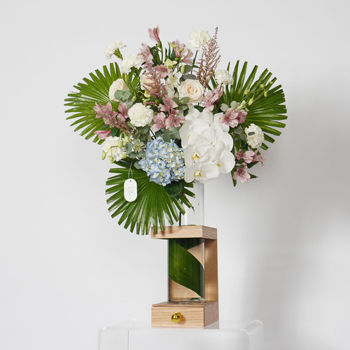 Isla - Wooden stand contains white orchid, blue hydrangea, rose, alstroemeria and Belgian chocolate  
 Height  93 Width 66