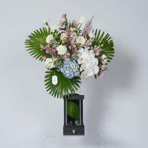 Isla 2 - this wooden vase contain rose, hydrangea, orchid and alstroemeria with Belgian chocolate  Height 93 width 66