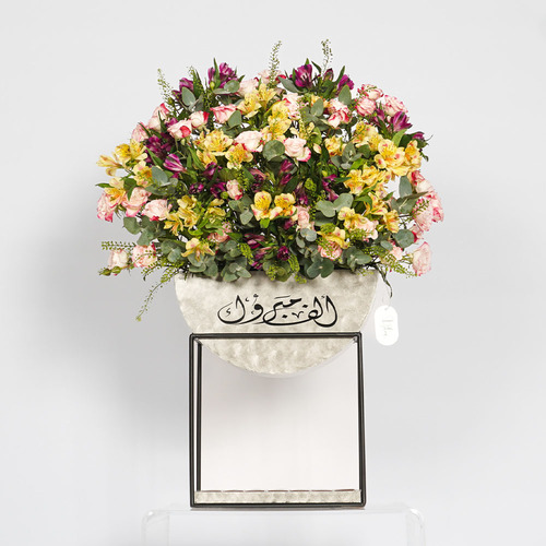 Daisy - wooden stand contain purple alstroemeria, yellow alstroemeria with light pink baby rose and Belgian chocolate. Height 82 Width 61