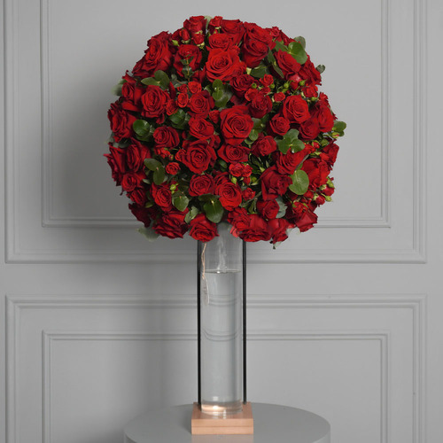 Hazel - wooden Stand with a glass vase contains 100 roses 20 baby roses and greens. Height 110 Width 52