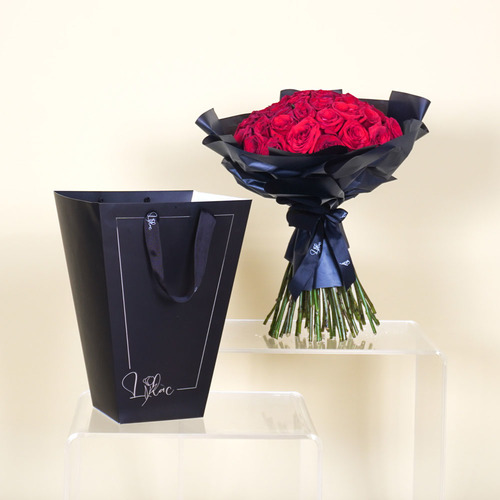 Luna - Hand bouquet of 50 red roses in a back bag. Height 50  Width 40