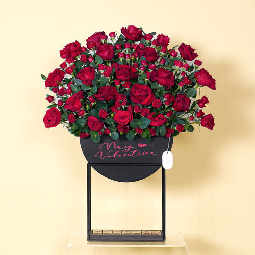 Naomi - Wooden black stand contains red roses and red baby rose with Belgian chocolate  Height 84 Width 65