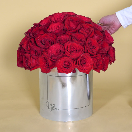 Lilac Flowers  - Jojo - Silver Metallic box contains 50 red roses  Height 37 Width 33