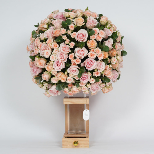 Jori - Glass on wood stand contains baby rose and a 100 roses peach and pink. Height 95 Width  75