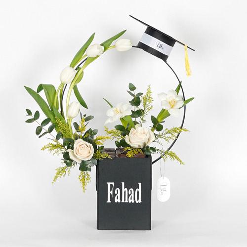 Fahad - wooden black vase contains white tulips, white rose and Belgian chocolate  Height 58 Width 40