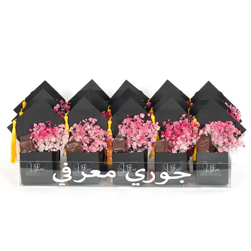 Giveaways - Personalized acrylic tray with 15 mini graduation cap boxes each box contains belgian chocolates and pink gypsophila.   Hight 17   width 40  Optional writing on the item 18 characters.