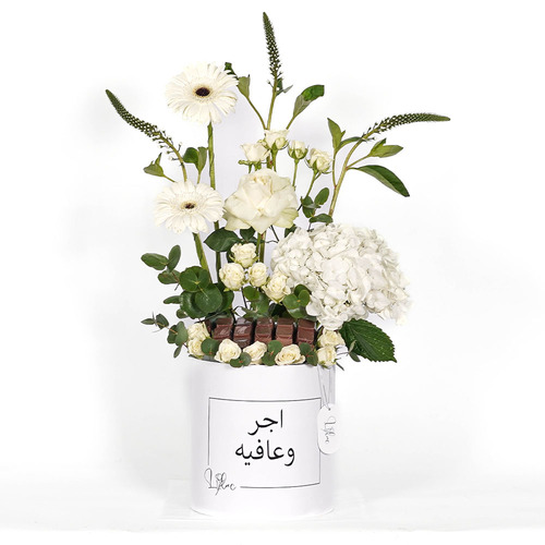 Suger - White box contains white hydrangea, white gerbera, white rose, white baby rose and begin chocolate  Height 72 Width 50