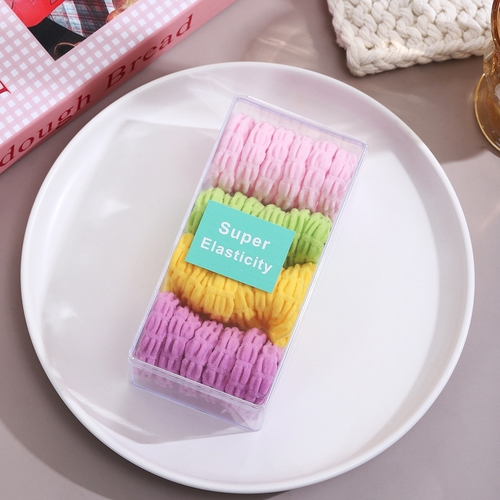 24-PIECE SCRUNCHIES - S83F - The set includes four colors : pink, purple, yellow and lime green.