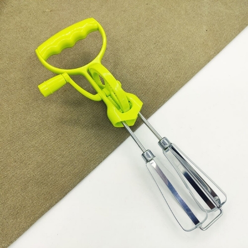 White rotary hand racket with green handle and metal structure.BH1646