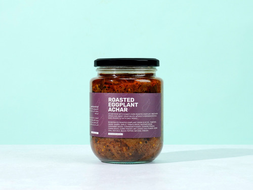 Roasted eggplant achar - Kuwaiti - Roasted eggplant achar.   Achar made with Kuwaiti oven-roasted eggplant, mixed with spices and sweet-sour sauce, without hydrogenated oils, goes perfectly with daily meals.   Ingredients: roasted eggplant, virgin olive oil, tomatoes, onion, ginger, garlic, tomato paste, mustard seeds, coriander seeds, coriander powder, turmeric powder, cumin seeds, cumin powder, bay leaves, chili powder, green chili, sea salt, black pepper, natural vinegar. 
 No added sugar