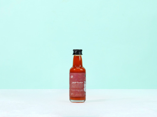 ALmahharah Hot Sauce - Hot sauce  A great addition for daily dishes specially for chilly pepper lovers.A thick and chili condiment that can be added to sandwiches, salads and cooking recipes. Mild Hot Ingredients: water, natural vinegar, sea salt, local chili pepper. 
 60ml