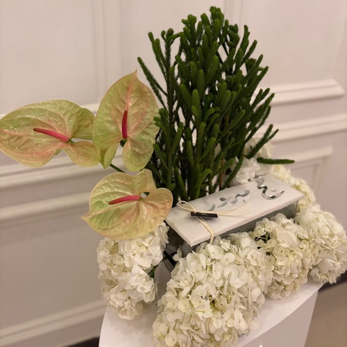 Embroidered box with chocolate on floral tray