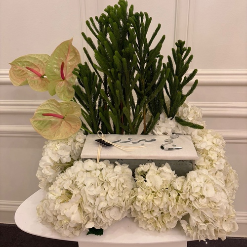 Embroidered box with chocolate on floral tray